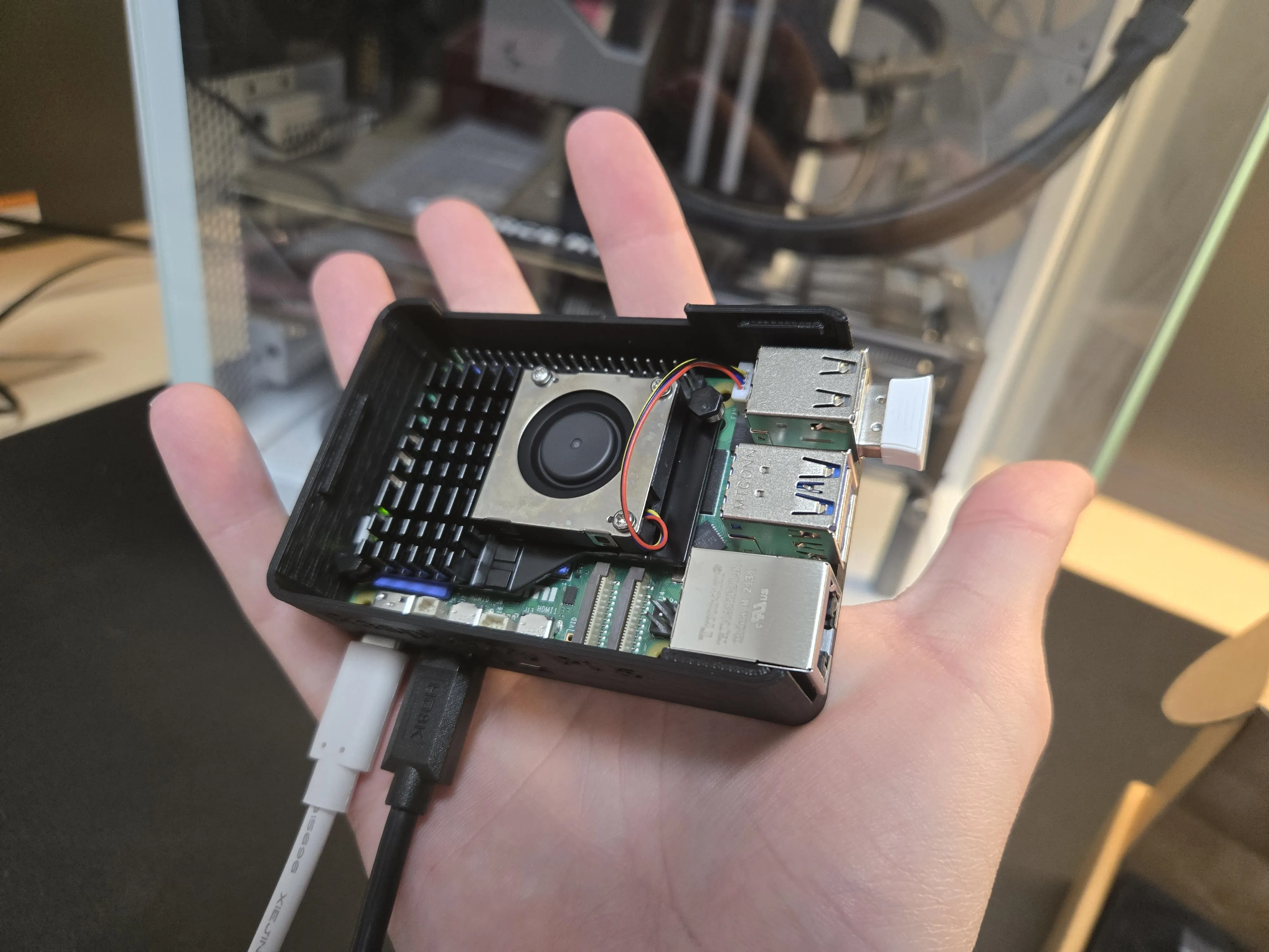 White PC case on table with components